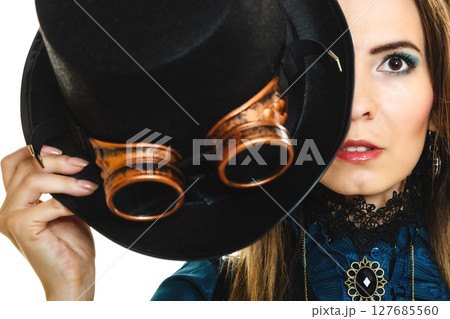 Portrait of beautiful steampunk woman isolated. 127685560