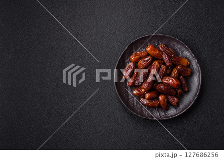 Dried tropical date fruit as an ingredient for fresh organic diet food 127686256