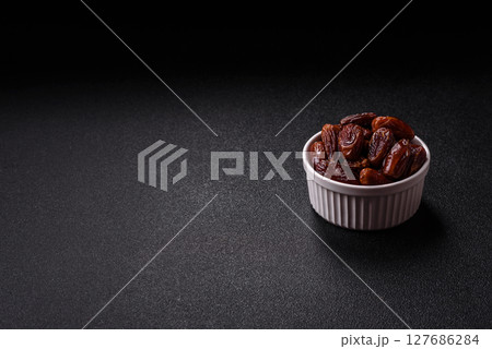 Dried tropical date fruit as an ingredient for fresh organic diet food Dried tropical date fruit as an ingredient for fresh organic diet food 127686284