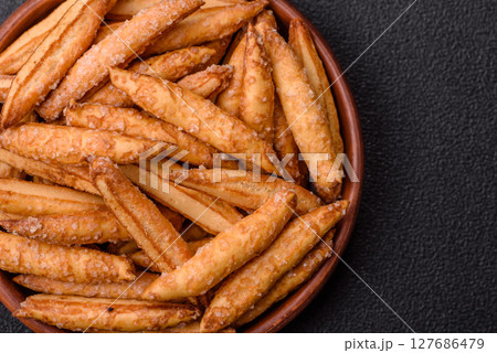 Cinnamon flavored biscuits or breadsticks 127686479