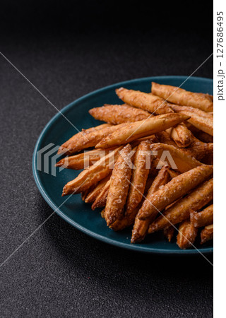 Cinnamon flavored biscuits or breadsticks Cinnamon flavored biscuits or breadsticks 127686495