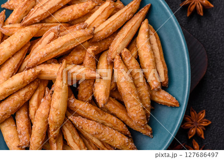 Cinnamon flavored biscuits or breadsticks Cinnamon flavored biscuits or breadsticks 127686497