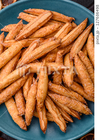 Cinnamon flavored biscuits or breadsticks Cinnamon flavored biscuits or breadsticks 127686498