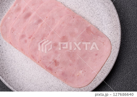 Eating ham and pork slices for the holiday table 127686640