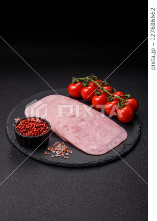 Eating ham and pork slices for the holiday table 127686662