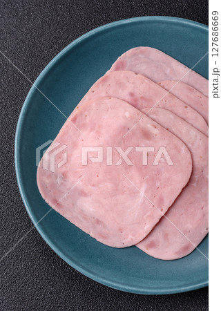 Eating ham and pork slices for the holiday table Eating ham and pork slices for the holiday table 127686669