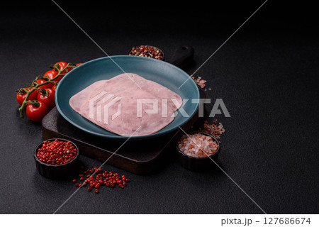Eating ham and pork slices for the holiday table 127686674