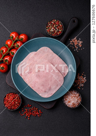 Eating ham and pork slices for the holiday table Eating ham and pork slices for the holiday table 127686676