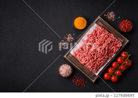 Ground beef mince fresh raw with salt and spices 127686695
