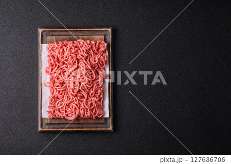 Ground beef mince fresh raw with salt and spices 127686706
