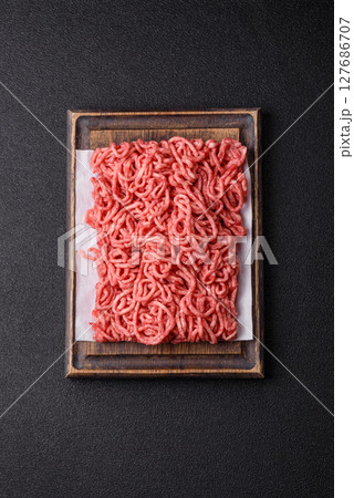 Ground beef mince fresh raw with salt and spices 127686707