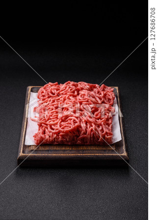Ground beef mince fresh raw with salt and spices 127686708