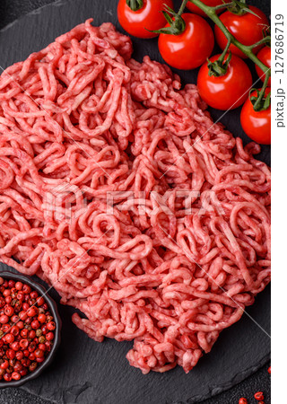 Ground beef mince fresh raw with salt and spices 127686719