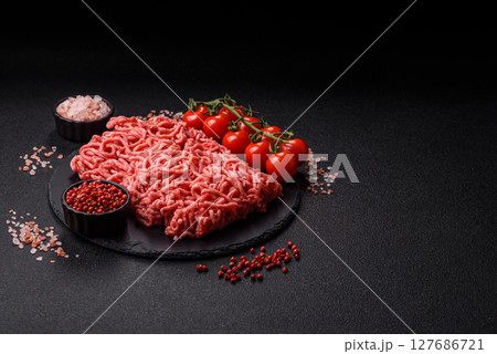 Ground beef mince fresh raw with salt and spices 127686721