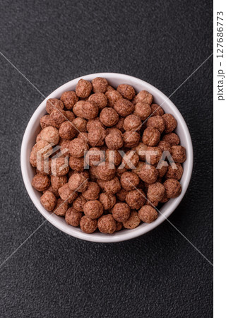 Cereal chocolate corn balls in a bowl 127686773