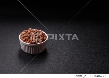 Cereal chocolate corn balls in a bowl 127686775