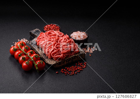Ground beef mince fresh raw with salt and spices 127686827
