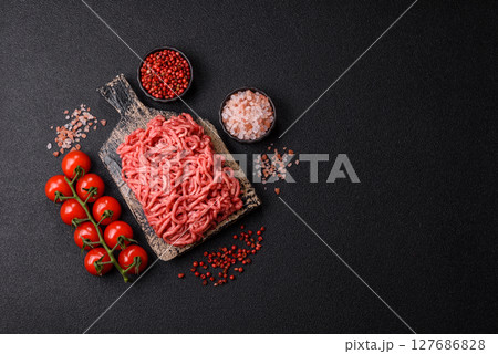 Ground beef mince fresh raw with salt and spices 127686828