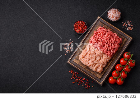 Beef and chicken minced meat, ground of two types fresh raw with salt and spices 127686832