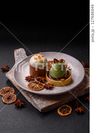 Easter sweet cake covered with icing with fruit and candied fruits Easter sweet cake covered with icing with fruit and candied fruits 127686849