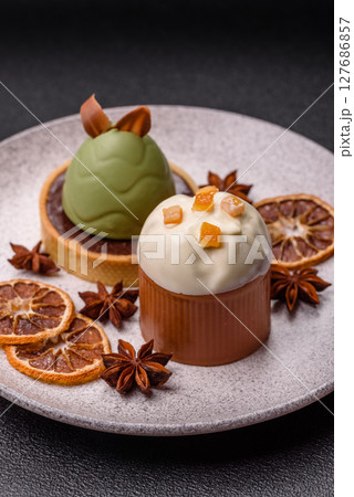 Easter sweet cake covered with icing with fruit and candied fruits Easter sweet cake covered with icing with fruit and candied fruits 127686857