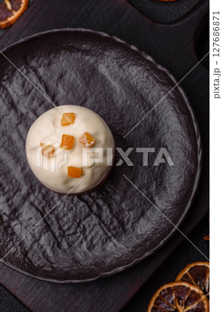 Easter sweet cake covered with icing with fruit and candied fruits Easter sweet cake covered with icing with fruit and candied fruits 127686871