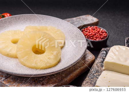 Tropical fruit pineapple in rings or slices tinned sweet Tropical fruit pineapple in rings or slices tinned sweet 127686933