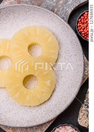 Tropical fruit pineapple in rings or slices tinned sweet Tropical fruit pineapple in rings or slices tinned sweet 127686935