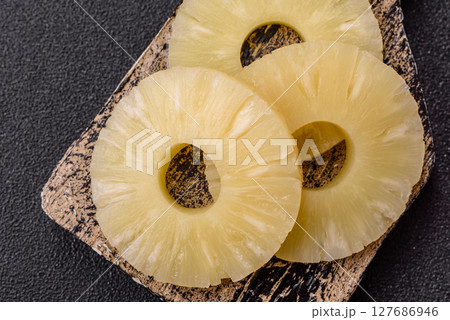 Tropical fruit pineapple in rings or slices tinned sweet Tropical fruit pineapple in rings or slices tinned sweet 127686946
