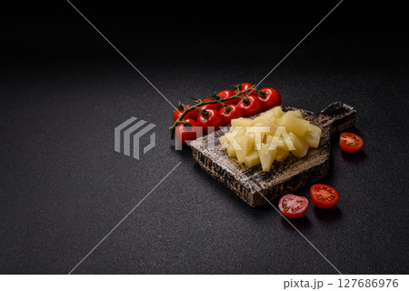 Tropical sweet tinned pineapple fruit sliced into slices 127686976