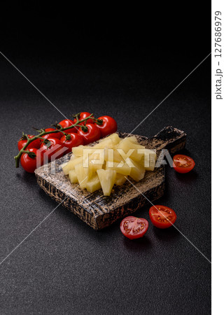 Tropical sweet tinned pineapple fruit sliced into slices Tropical sweet tinned pineapple fruit sliced into slices 127686979