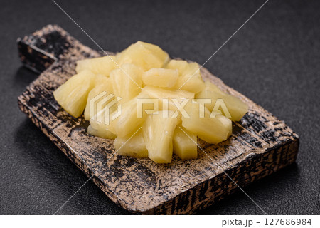 Tropical sweet tinned pineapple fruit sliced into slices 127686984