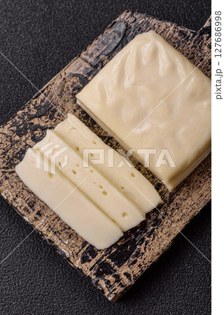 Dairy white mozzarella cheese sliced 127686998