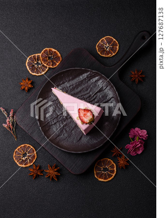 A slice of pink colored puff cake for a birthday celebration A slice of pink colored puff cake for a birthday celebration 127687138