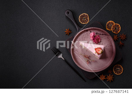 A slice of pink colored puff cake for a birthday celebration A slice of pink colored puff cake for a birthday celebration 127687141