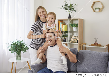 Portrait Of Happy Family With Child At Home Portrait Of Happy Family With Child At Home 127687244