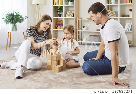 Happy friendly loving family at home close enjoy playing carefully wood cube board game together Happy friendly loving family at home close enjoy playing carefully wood cube board game together 127687271