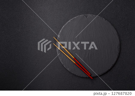 An empty plate with chopsticks for Japanese or Chinese food 127687820