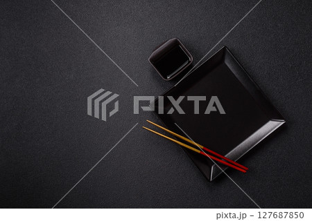 An empty plate with chopsticks for Japanese or Chinese food An empty plate with chopsticks for Japanese or Chinese food 127687850