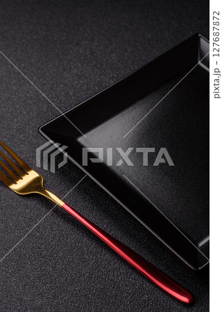 Empty plate with fork, cutlery for dinner table 127687872