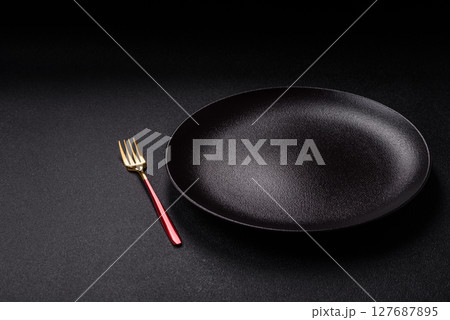 Empty plate with fork, cutlery for dinner table Empty plate with fork, cutlery for dinner table 127687895