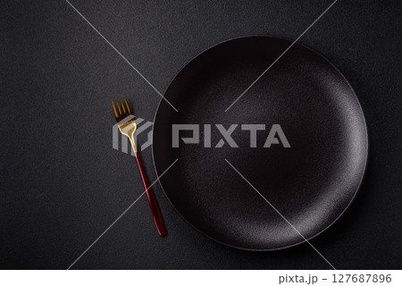 Empty plate with fork, cutlery for dinner table Empty plate with fork, cutlery for dinner table 127687896
