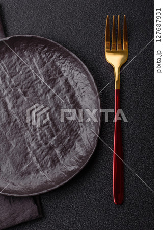 Empty plate with fork, cutlery for dinner table Empty plate with fork, cutlery for dinner table 127687931