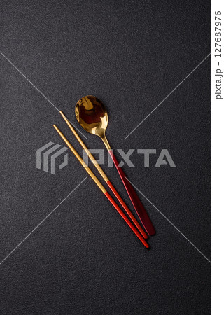 Fork, spoon, chopsticks set of kitchen utensils 127687976
