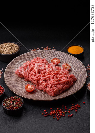 Stuffing or ground raw beef or pork with salt and spices Stuffing or ground raw beef or pork with salt and spices 127688758