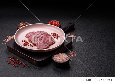Sliced salami sausage, smoked meat, delicious deli snacks Sliced salami sausage, smoked meat, delicious deli snacks 127688864