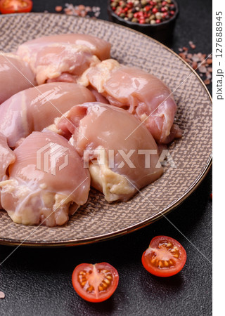 Chicken thigh fillet raw, skinless, boneless, poultry legs 127688945