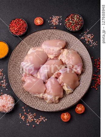Chicken thigh fillet raw, skinless, boneless, poultry legs Chicken thigh fillet raw, skinless, boneless, poultry legs 127688948
