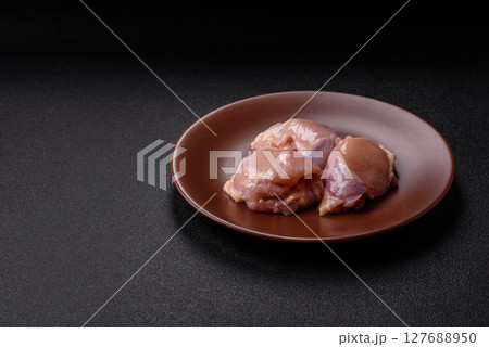 Chicken thigh fillet raw, skinless, boneless, poultry legs 127688950