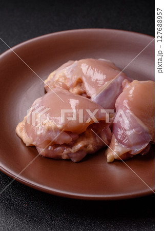 Chicken thigh fillet raw, skinless, boneless, poultry legs Chicken thigh fillet raw, skinless, boneless, poultry legs 127688957